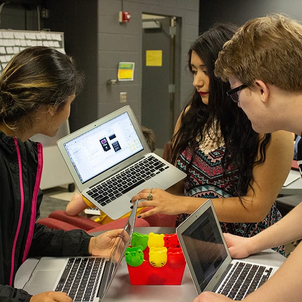 Students around laptop