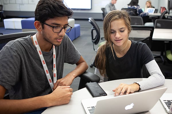 Two student at laptop