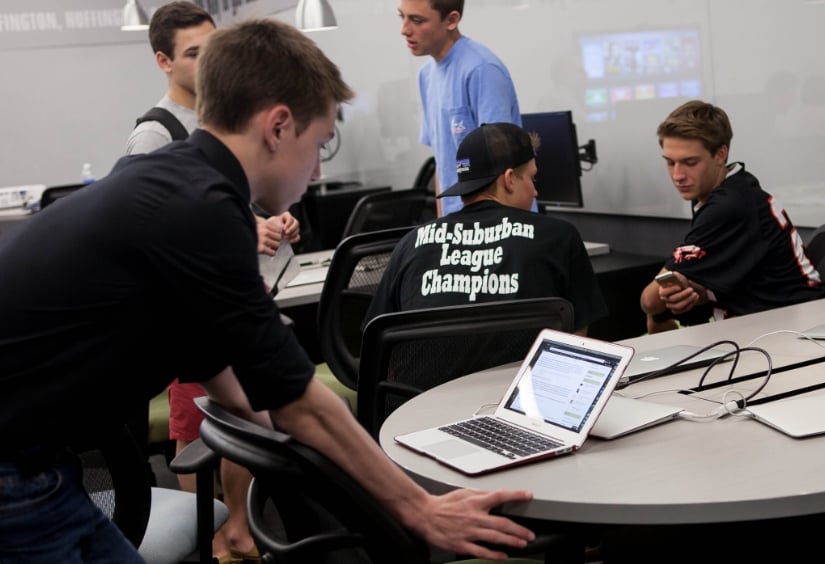 students with laptop